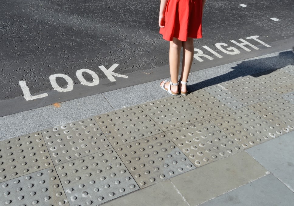 Woman about to cross the road